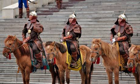 Mongolian soldiers on horseback welcome